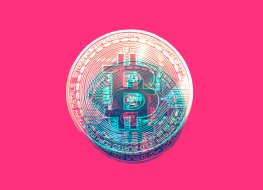 Representative image of a bitcoin on a pink background 