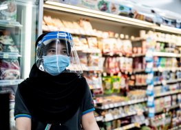 Thai store worker wearing face mask