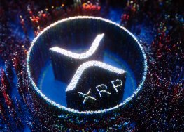 XRP logo depicted in white pinpoint lights on a blue and multicoloured background of pinpoint lights