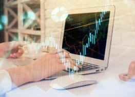 Double exposure of woman hands typing on computer and forex chart hologram drawing. Stock market analysis concept.