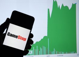 GameStop retail company logo on the smartphone and its authentic stock price chart for the last 5 days.