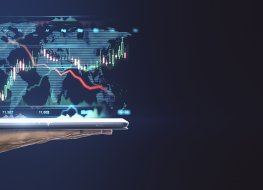 World growth Digital tablet on human hand with financial graphs and world map