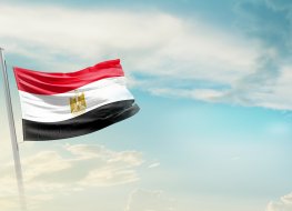 Egypt national flag waving in beautiful sky.