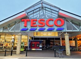 HALIFAX, UK - MAY 14, 2021: A Tesco supermarket exterior in the early morning before the shoppers arrive. A British multinational groceries retailer