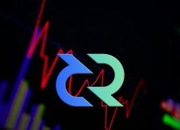 The Decred logo in front of a price chart