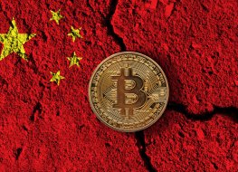 Bitcoin cryptocurrency coin with a cracked China flag