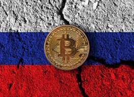 Bitcoin on a cracked Russian flag
