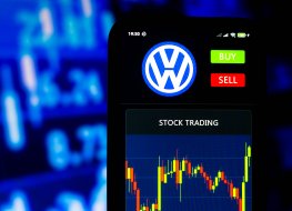 Volkswagen logo and a stock chart