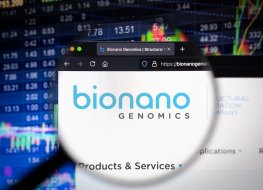 KAUFBEUREN, GERMANY - JUNE 12, 2021: Bionano Genomics company logo on a website with blurry stock market developments in the background, seen on a computer screen through a magnifying glass.