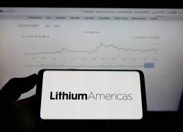 Stuttgart, Germany - 06-20-2021: Person holding mobile phone with logo of Canadian company Lithium Americas Corp. on screen in front of business web page. Focus on phone display. Unmodified photo.
