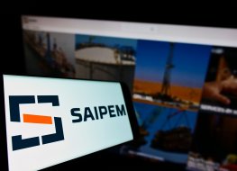 Saipem stock forecast: Is now the time to pick up SPM shares at a bargain? Smartphone with logo of Italian oilfield services company Saipem S p A on screen in front of business website Focus on left of phone display