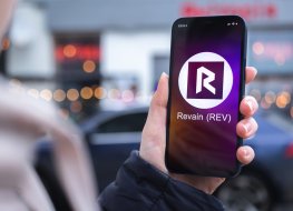 Revain (REV) logo on a smartphone screen