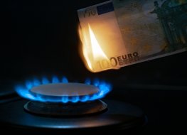 100 euro banknote on a gas burner. The concept of cost for natural gas. Energy crisis.