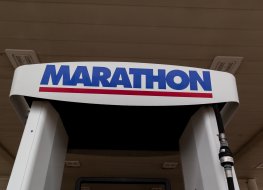 Close up of Marathon sign at a gas station. Marathon Petroleum Corporation is an American petroleum refining, marketing, and transportation company.