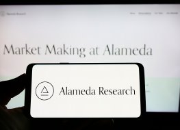 Alameda Research logo on smartphone and computer screen 