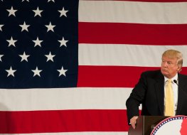 Photo of Donald Trump in front of flag; Shutterstock Photo of Donald Trump in front of flag