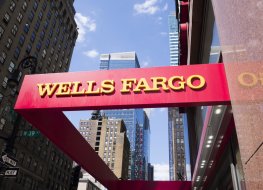 New York, New York, USA - May 31, 2012: A Wells Fargo sign at a Wells Fargo location in Midtown Manhattan. Manhattan buildings can be seen in the background.