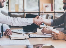 two people shake hands on a deal 