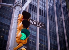 Green traffic light on Wall Street 