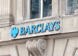 Exterior of an old stone building bearing the Barclays name and logo