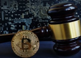 Bitcoin in front of a gavel