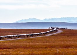 Crude oil Oil pipeline against a mountain backdrop