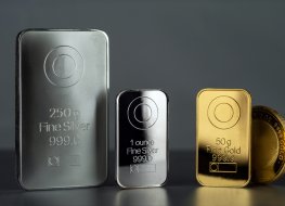 Silver and gold bars Silver and gold bars and coin on a dark background