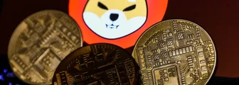 Shiba Inu cryptocurrency logo displayed on a phone screen and representation of cryptocurrency are seen in this illustration photo taken in Krakow, Poland on 2 November 2021