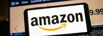 photo illustration an Amazon logo seen displayed on a smartphone.