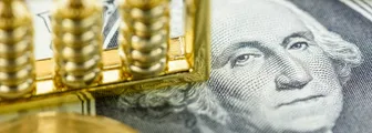 DXY forecast: Will rate hikes support USD dominance? Money supply, economic concept : Chinese abacus on one US dollar paper currency with image of George Washington, depicts global infleunce and major impact of the USD, FED central bank around the world
