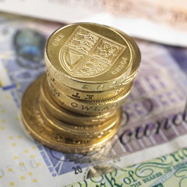 British banknotes and coins photographed directly above