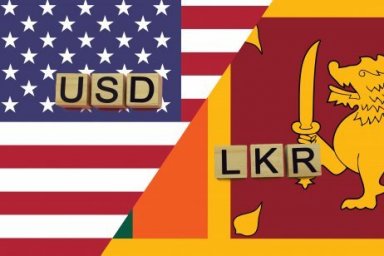 رموز العملات للولايات المتحدة الأمريكية (USD) وسريلانكا (LKR) على أعلامهما الوطنية