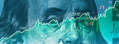 Closeup Benjamin Franklin face on USD banknote with stock market chart graph for currency exchange and global trade forex concept.