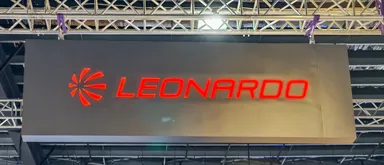 Leonardo company logo illuminated in red on a large display panel