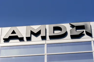 AMD logo mounted on the exterior of a modern office building