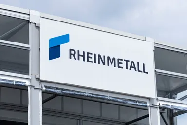 Rheinmetall logo displayed on the exterior of a modern building.