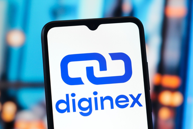 Diginex logo displayed on a smartphone screen with a blurred blue and orange background.