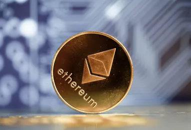 Close-up of a physical Ethereum coin with the Ethereum logo