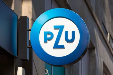 PZU logo displayed on a sign mounted on a building exterior