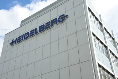 Heidelberg company logo mounted on the exterior wall of a modern office building.