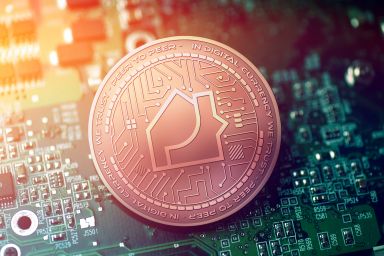 Propy price prediction: Will the real estate NFT soar high?  shiny copper PROPY cryptocurrency coin on blurry motherboard background