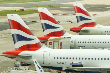 British Airways aircraft tails at an airport gate
