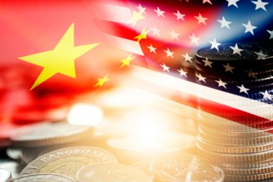 USA and China flag on coins stacking