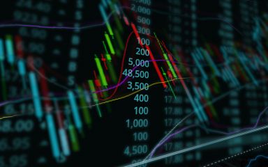Representative candlestick chart with a double exposure of a graph to illustrate finance