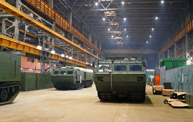 Assembly of tracked military vehicles inside a large industrial manufacturing plant