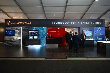 eonardo corporate booth presenting aerospace and defense systems at an industry exhibition.