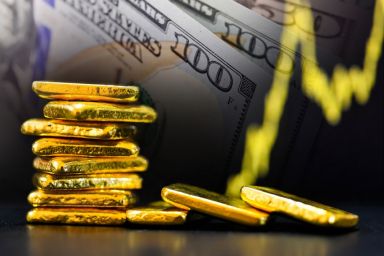 Gold bars and US dollar bill banknotes background.
