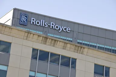 Rolls-Royce logo and signage displayed on the exterior of a company building.