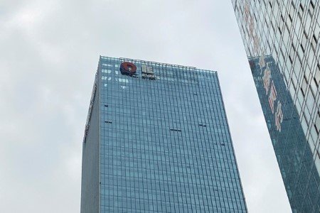 A partially removed company logo of China Evergrande Group is seen on the facade of its headquarters in Shenzhen, Guangdong province, China, January 10, 2022. A partially removed company logo of China Evergrande Group is seen on the facade of its headquarters in Shenzhen, Guangdong province, China, January 10, 2022.