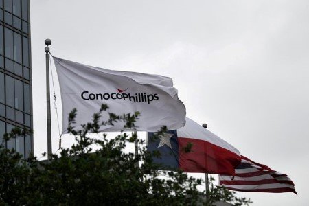 A file photo shows flags flying outside ConocoPhillips offices in Houston, Texas, U.S., April 30, 2019. 